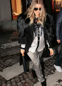 Pregnant Fergie wearing black striped pants